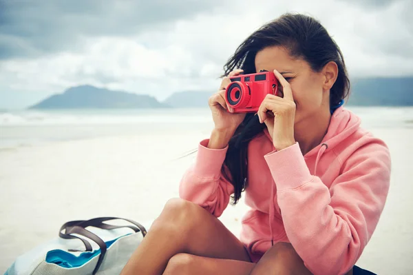 Woman taking photo with old camera