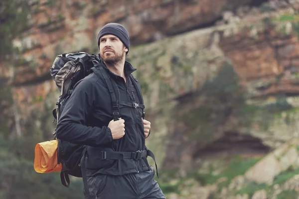 Man in mountains with backpack