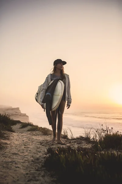 Female Surfer looking for waves
