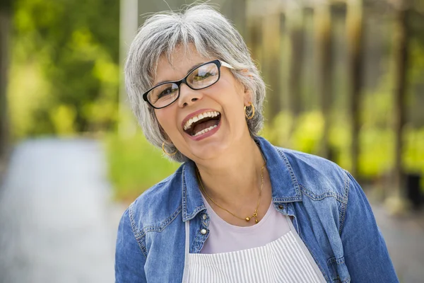 Mature woman laughing