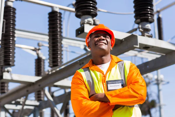 African engineer with arms crossed