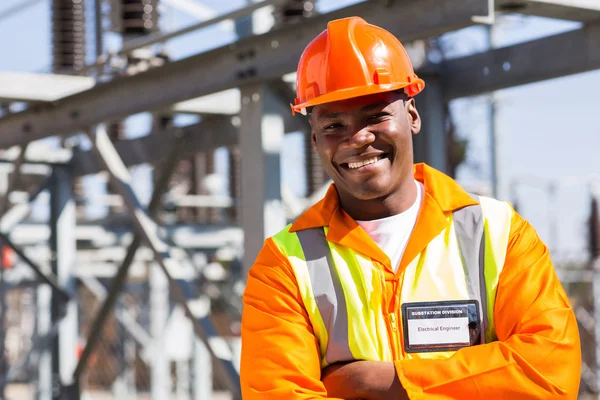 African engineer with arms crossed