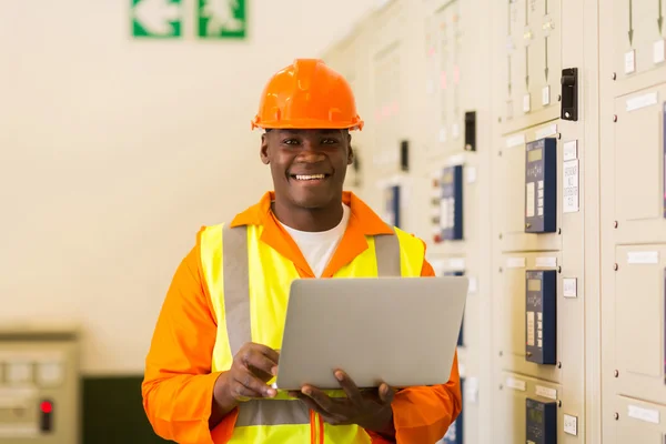 African electrical engineer with laptop