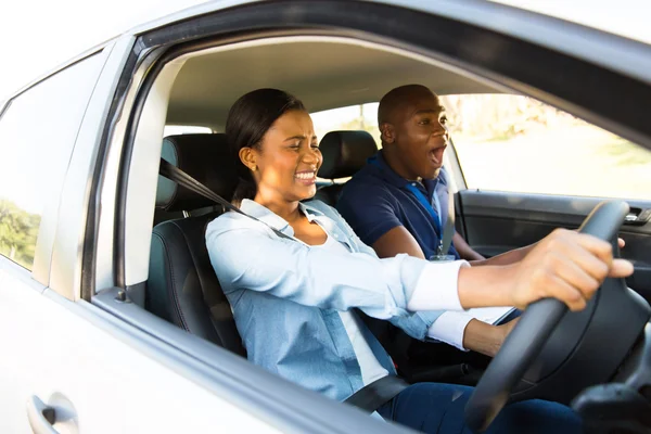 Girl taking driving lessons