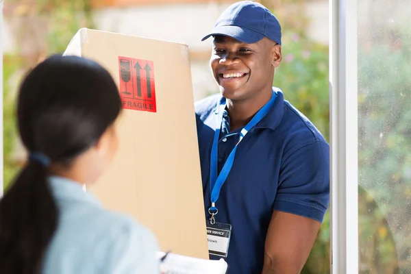 African-american delivery man with package