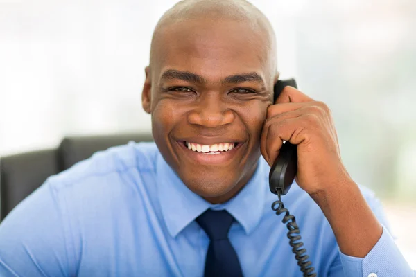 African businessman using phone