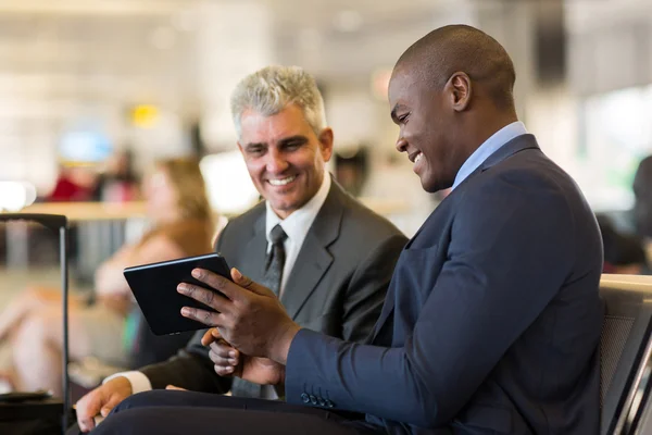 Business travelers using tablet