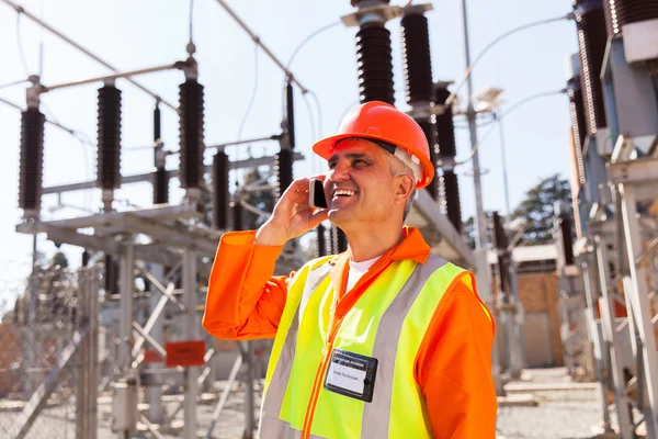 Technician talking on cell phone