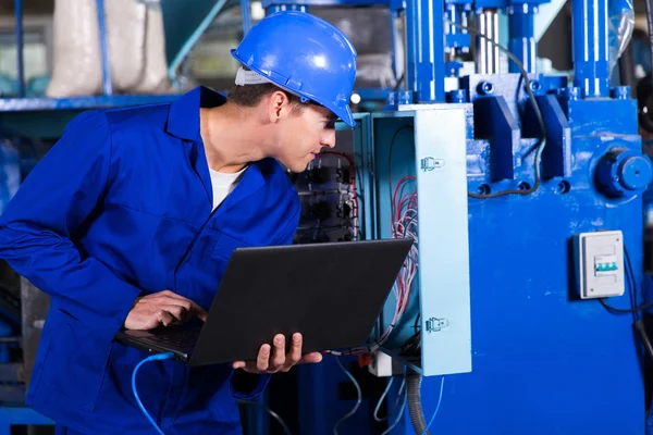 Technician checking distribution box