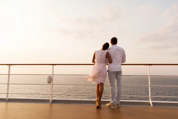 Couple standing on ship deck
