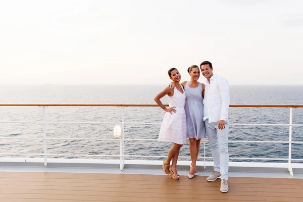 Friends standing on cruise ship deck