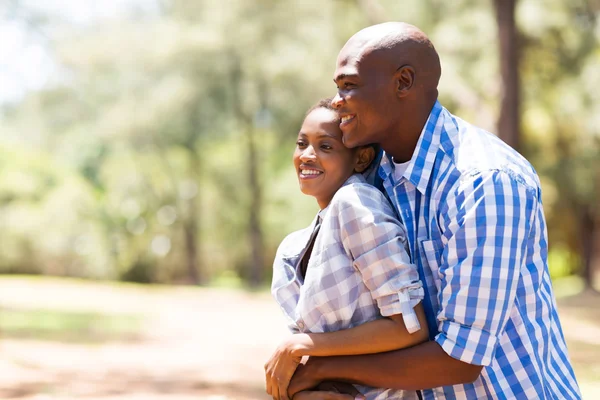 Young african couple looking away