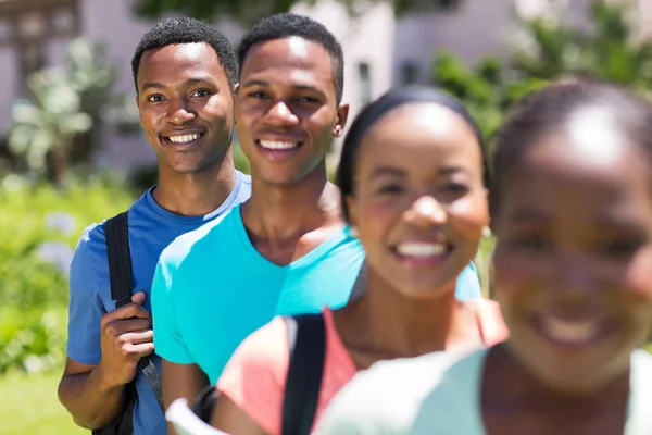 African student standing in a row