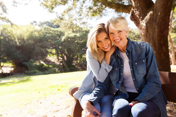 Mother and daughter sitting