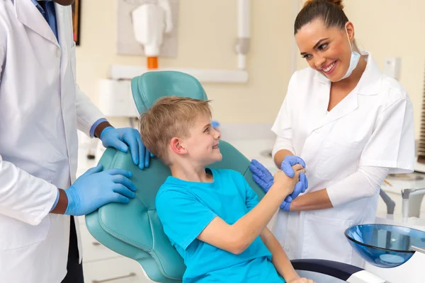 Assistant greeting little patient