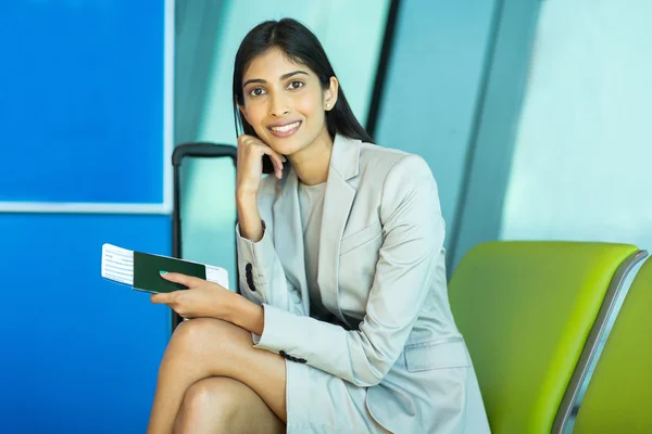 Business traveler sitting at airport