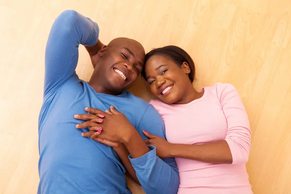 Couple lying on floor