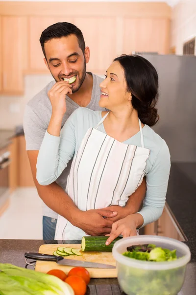 Indian couple cooking together