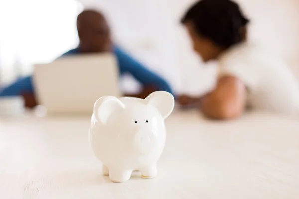 Piggy bank with african couple