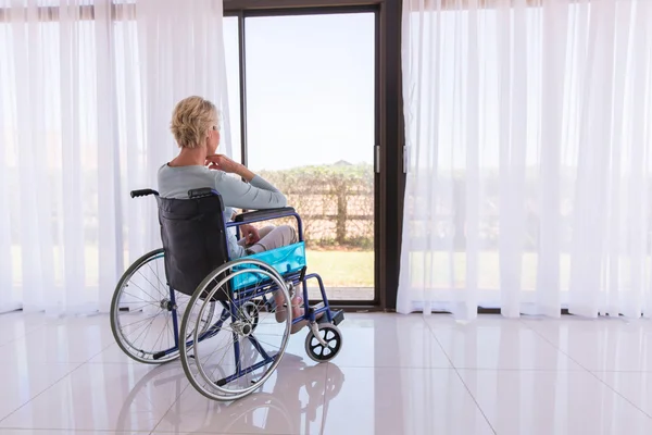 Middle aged woman sitting in wheelchair