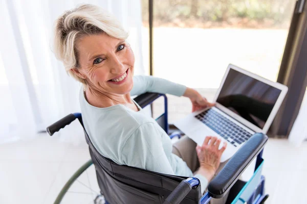 Disabled woman with laptop computer