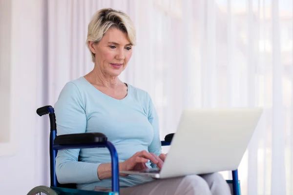 Disabled woman with laptop computer