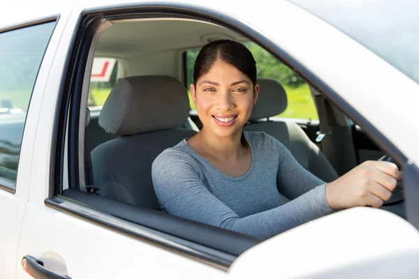 Female driver in car