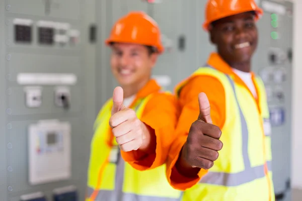 Technical co-workers with thumbs up