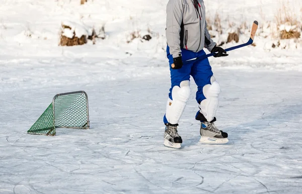 Hockey player on the ice, outdoor.