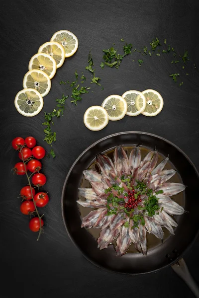 Marinated Anchovies On Black Table