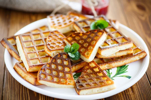 Baked cheese waffles with powdered sugar