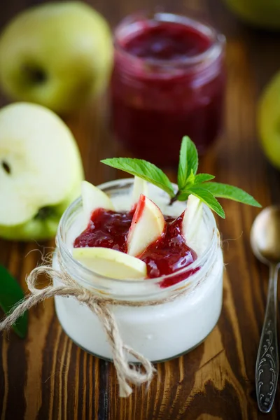 Sweet homemade yogurt with apples and jam