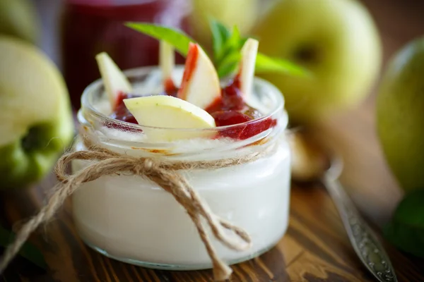 Sweet homemade yogurt with apples and jam