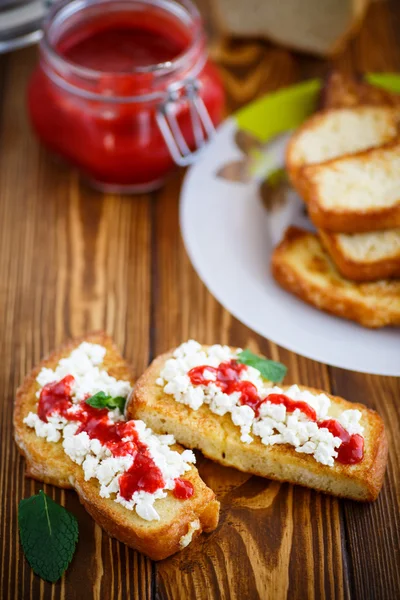 Fried in batter toast with cream cheese and jam