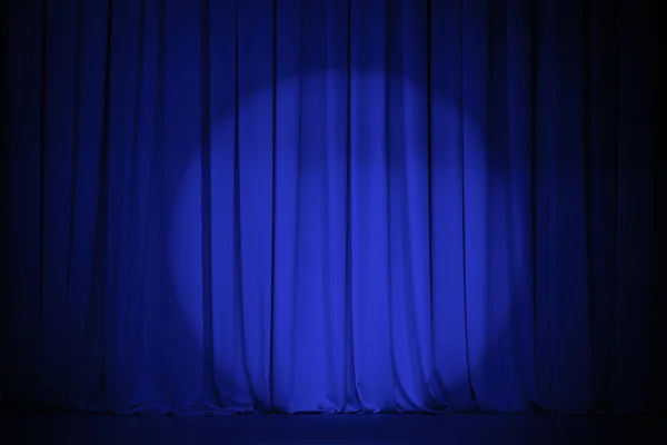 Theater blue curtain with light spot