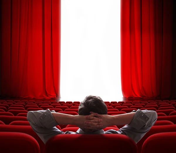 Cinema screen red curtains opening for vip person