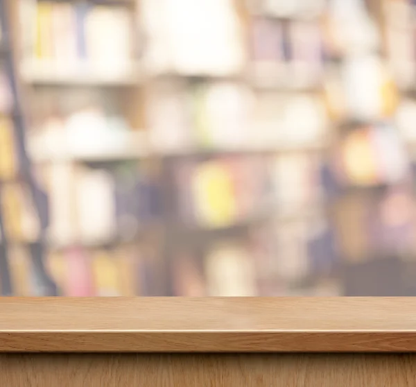 Empty wood shelf for product display in book shop or library