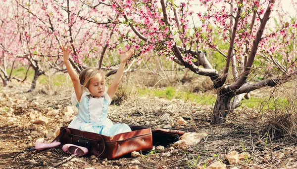 Girl sitting in vintage bag