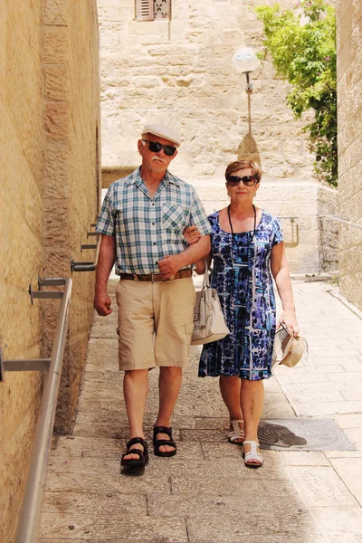 Senior couple walking in town