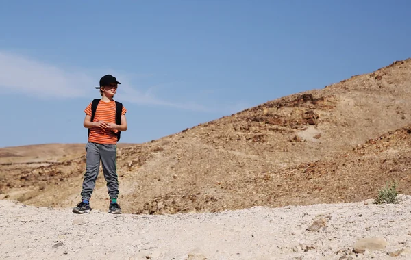 Boy hiking in the desert