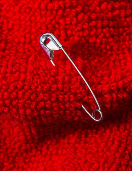 Safety pin pinned to the texture