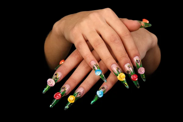 Pretty woman hand with perfect painted nails isolated on black background