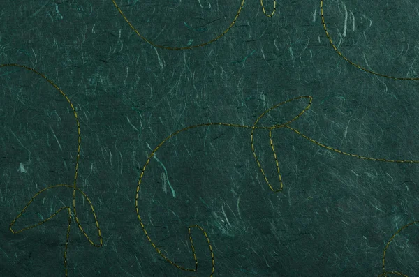 Stitched green recycled paper