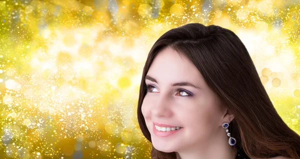 Beauty, people and health concept - beautiful young Women face over blue Christmas background
