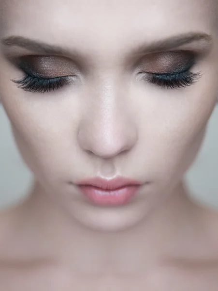 Woman eye with beautiful makeup and long eyelashes.