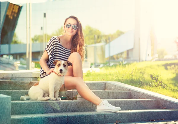 Happy Hipster Girl with her Dog in the City