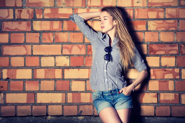 Street Style Fashion Girl at the Brick Wall