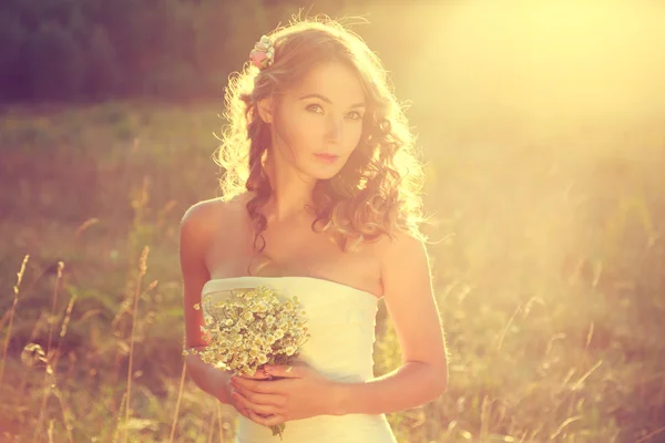 Stylish Young Bride Outdoors at Sunset