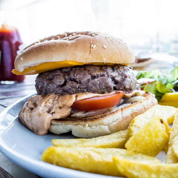Cheese burger - American cheese burger with Golden French fries