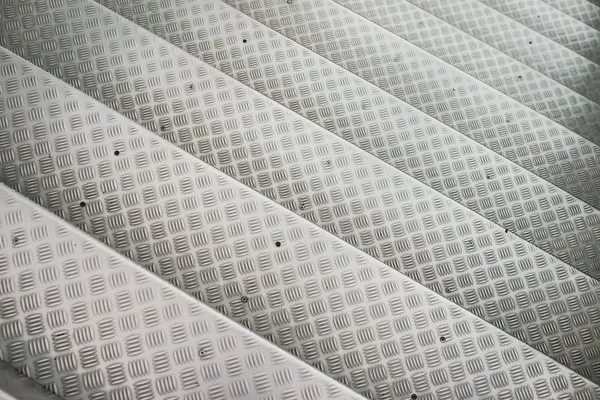 Aluminum steps  with non-slip pattern.